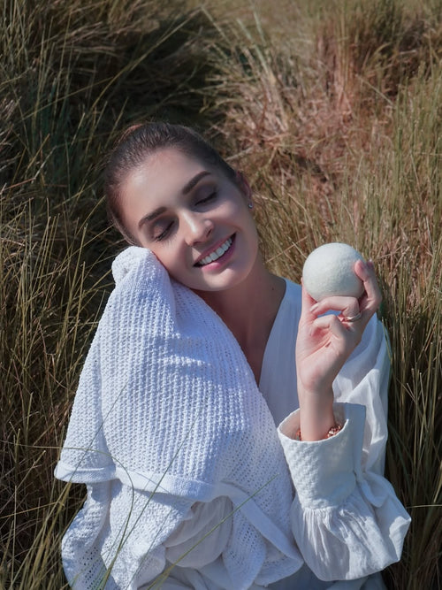 Woman holding dryer ball